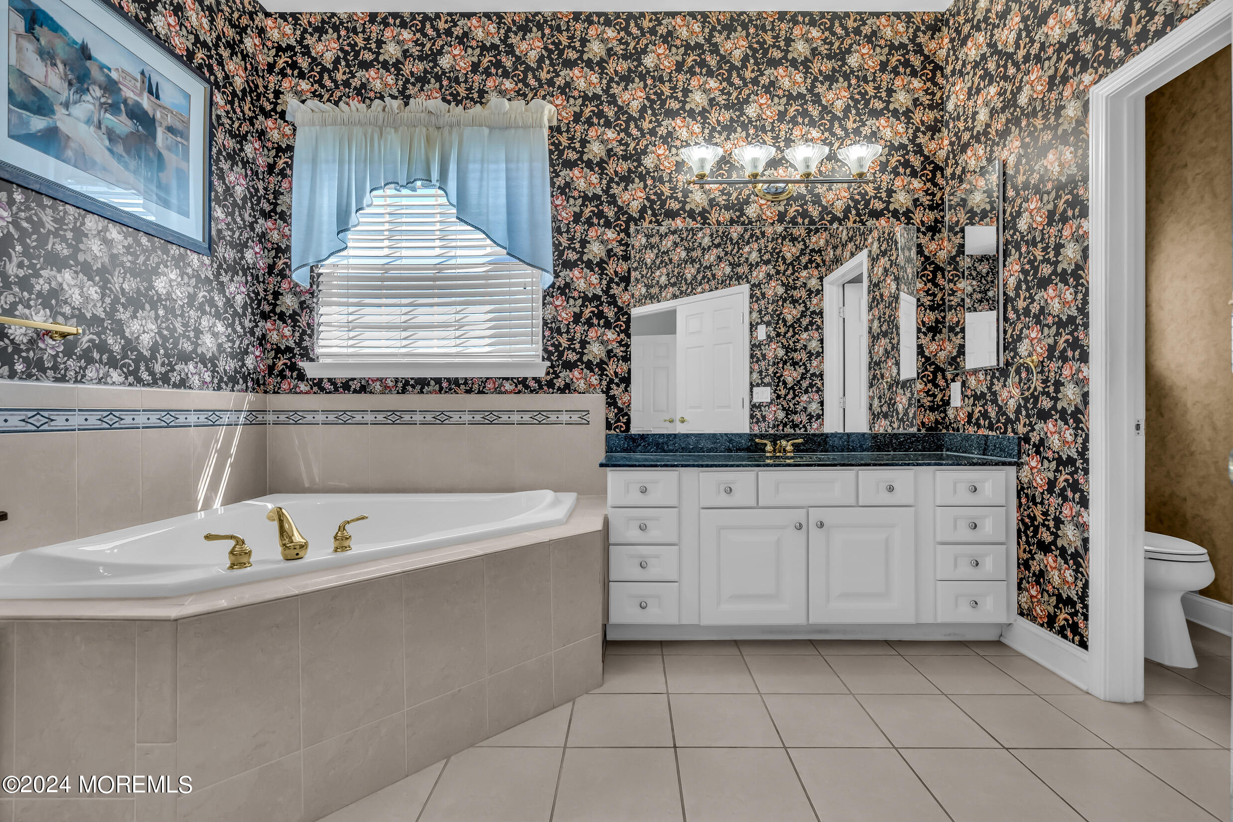 14 Headwaters Place Barnegat, NJ 08005 - Photo 45 of 68 a bathroom with a sink a mirror and a bathtub