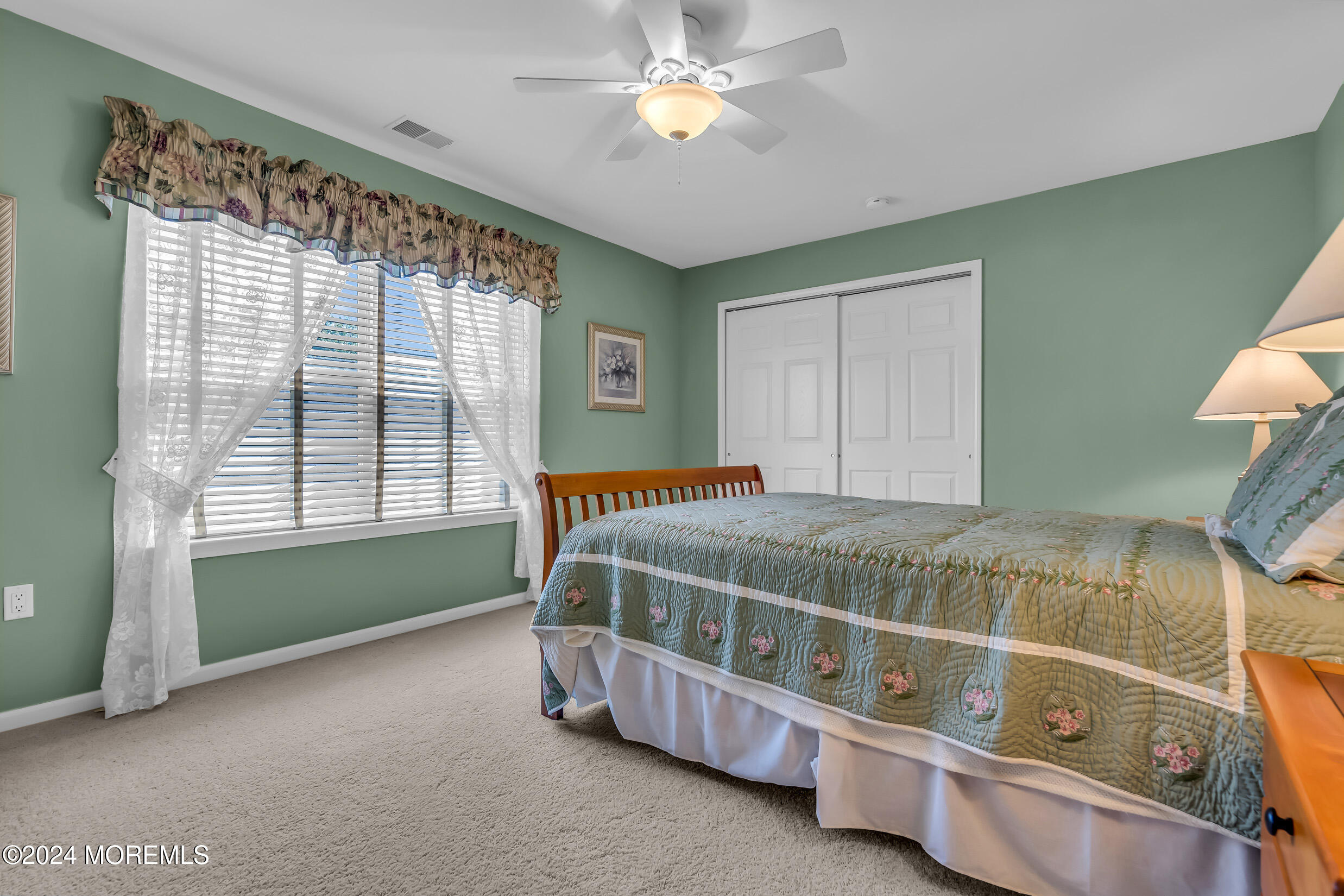 14 Headwaters Place Barnegat, NJ 08005 - Photo 55 of 68 a bedroom with a bed and a chandelier