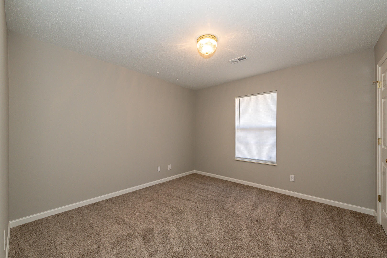 3869 Big Springs Ridge Road Friendsville, TN 37737 - Photo 17 of 21 an empty room with a window