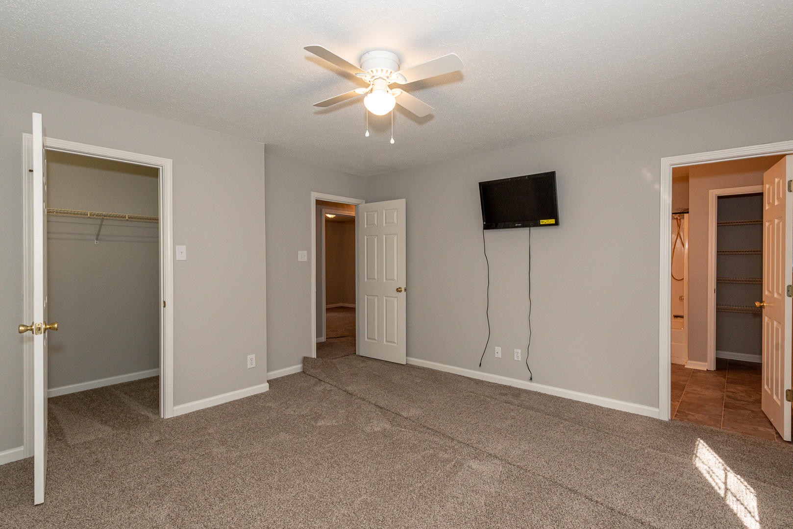 3869 Big Springs Ridge Road Friendsville, TN 37737 - Photo 19 of 21 a view of an empty room with a ceiling fan and a bathroom
