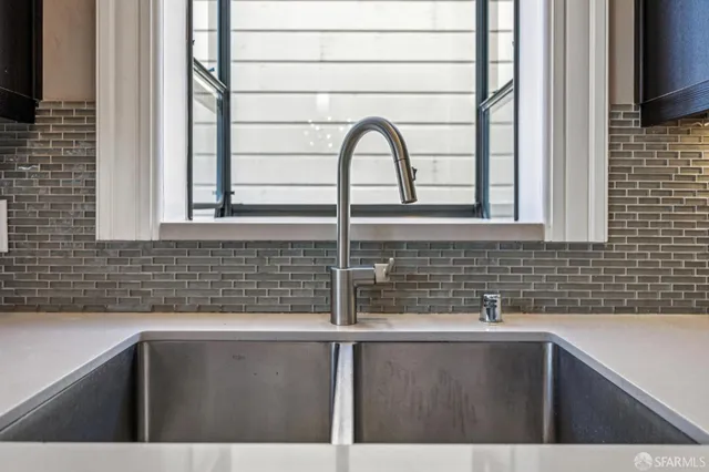 a view of a sink and a window