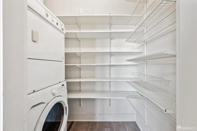 a view of walk in closet with empty racks