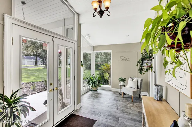 a bathroom with a granite countertop toilet sink and mirror