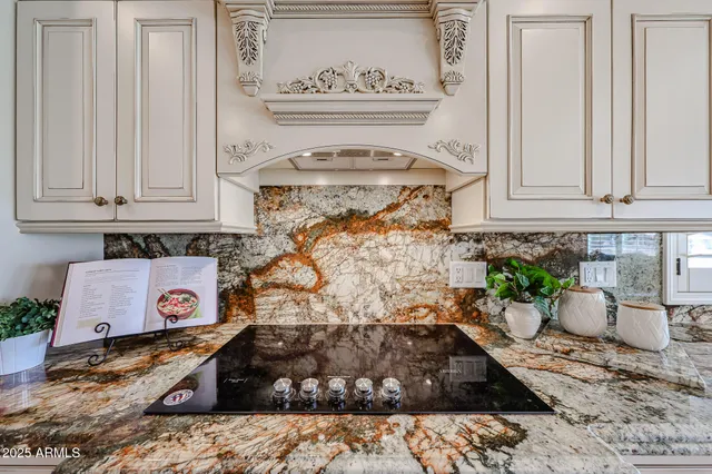 a kitchen that has a table and chairs in it
