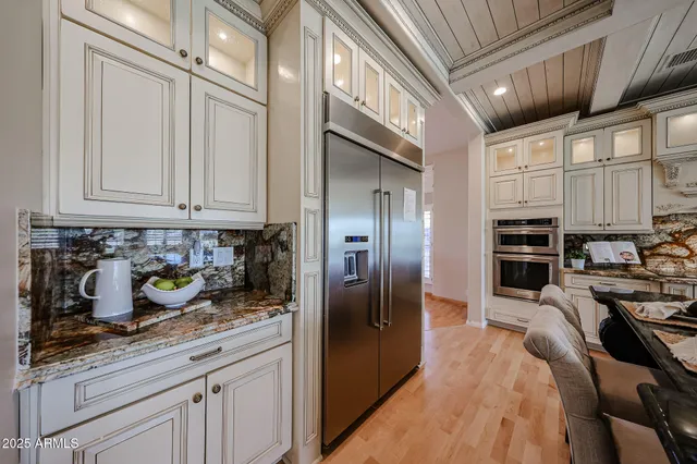 a view of a dining room with furniture chandelier and wooden floor