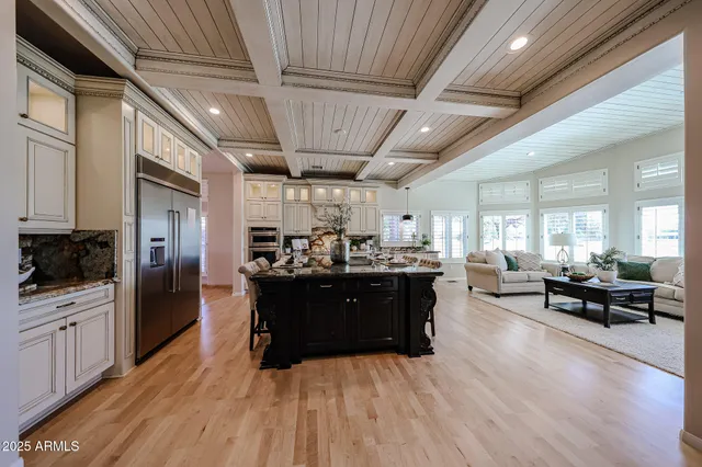 a kitchen with stainless steel appliances granite countertop a stove and cabinets