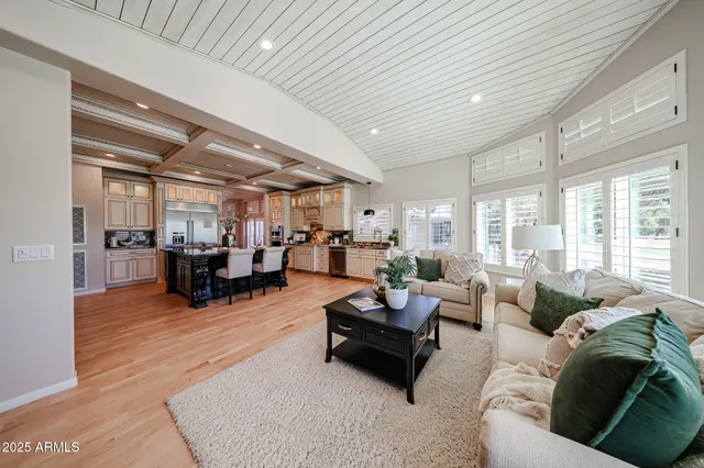 a dining room with furniture and wooden floor