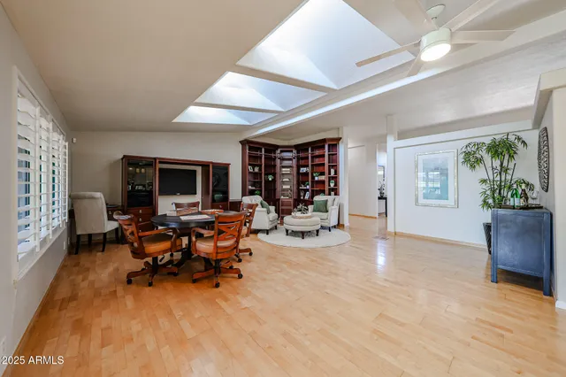 a view of a dining room with furniture and window