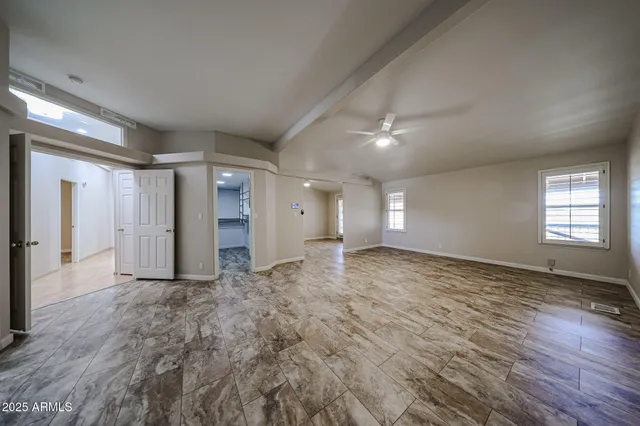 a bathroom with a tub and shower