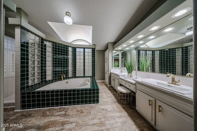 a dining hall with stainless steel appliances granite countertop a stove oven a dining table and chairs with wooden floor