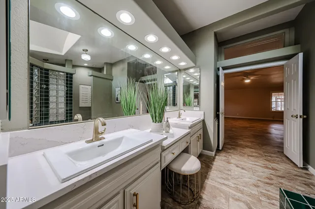 a view of a sign board with a tree