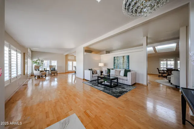 a living room with furniture window and wooden floor