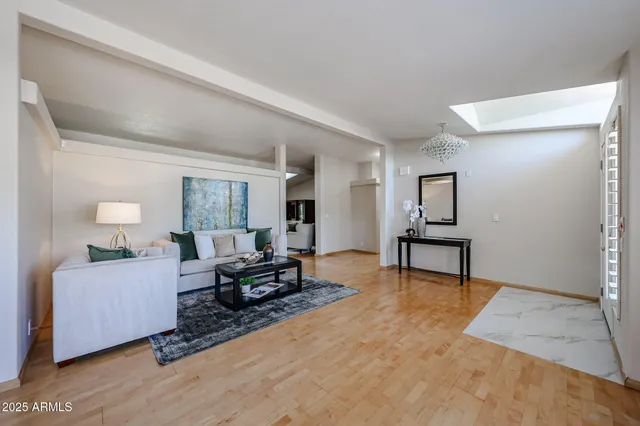 a view of a livingroom with furniture and a table
