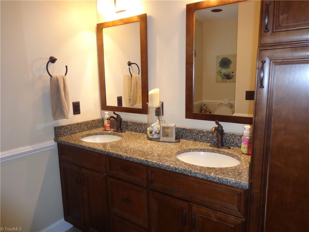 9009 Racine Road Pleasant Garden, NC 27313 - Photo 13 of 21 Updated MBA has New Granite Dble Vanity, Tile flooring and walk-in Shower