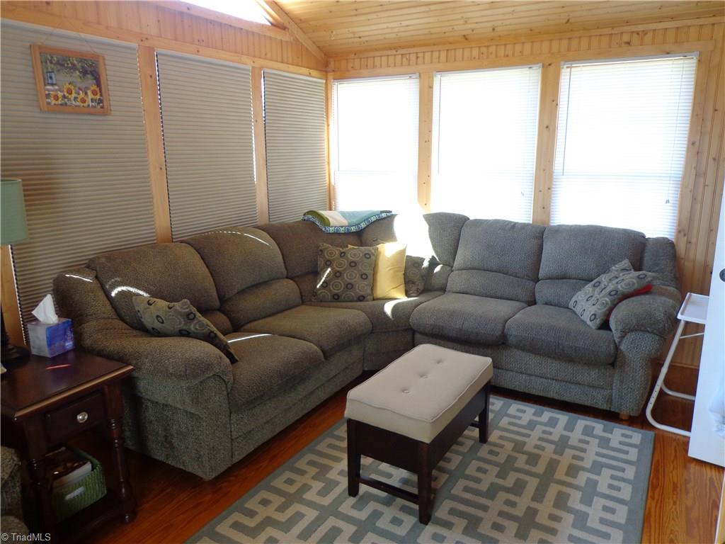 9009 Racine Road Pleasant Garden, NC 27313 - Photo 9 of 21 Sunroom features Pine Floors, Walls & Ceiling