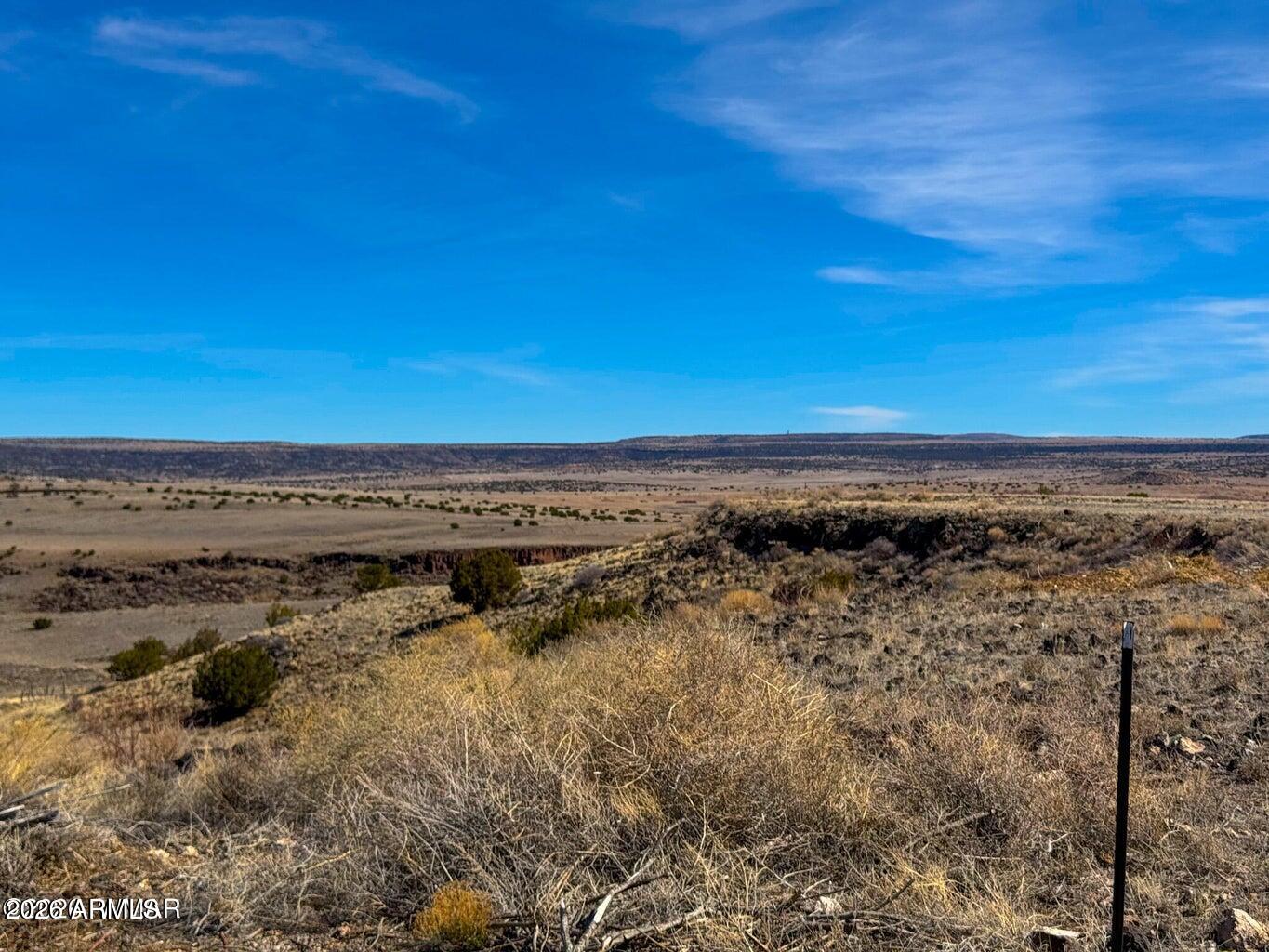a view of a large body of water with a building in the background