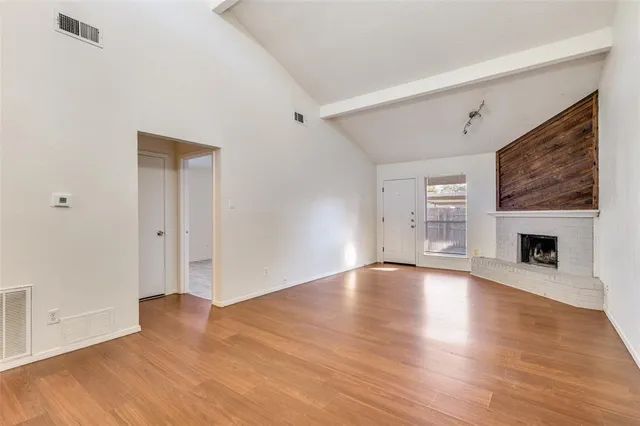 a kitchen with granite countertop a sink cabinets and stainless steel appliances
