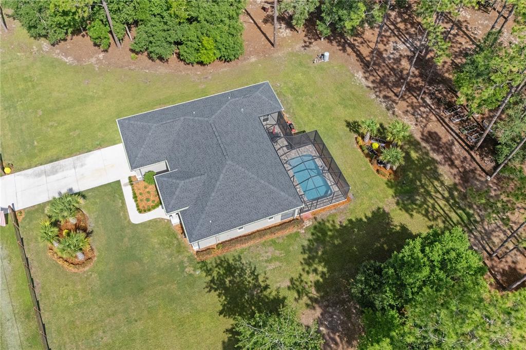 12929 Southwest 89th Street Dunnellon, FL 34432 - Photo 69 of 76 an aerial view of a house with swimming pool and garden