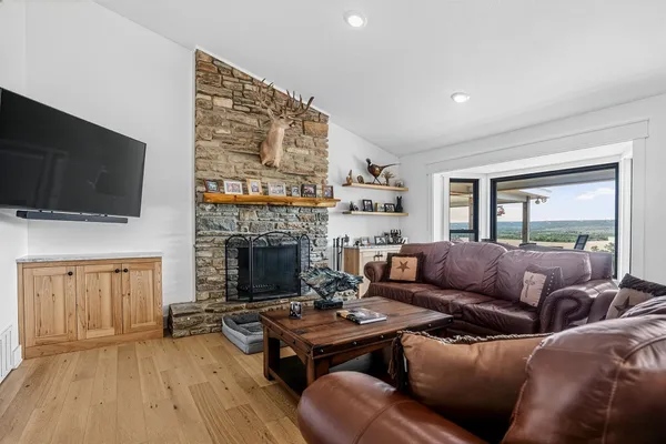 a living room with furniture and a fireplace