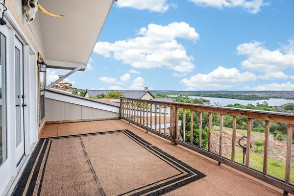 a view of balcony with furniture