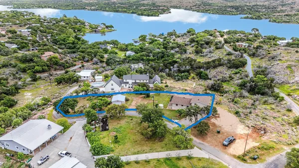 an aerial view of a houses with outdoor space