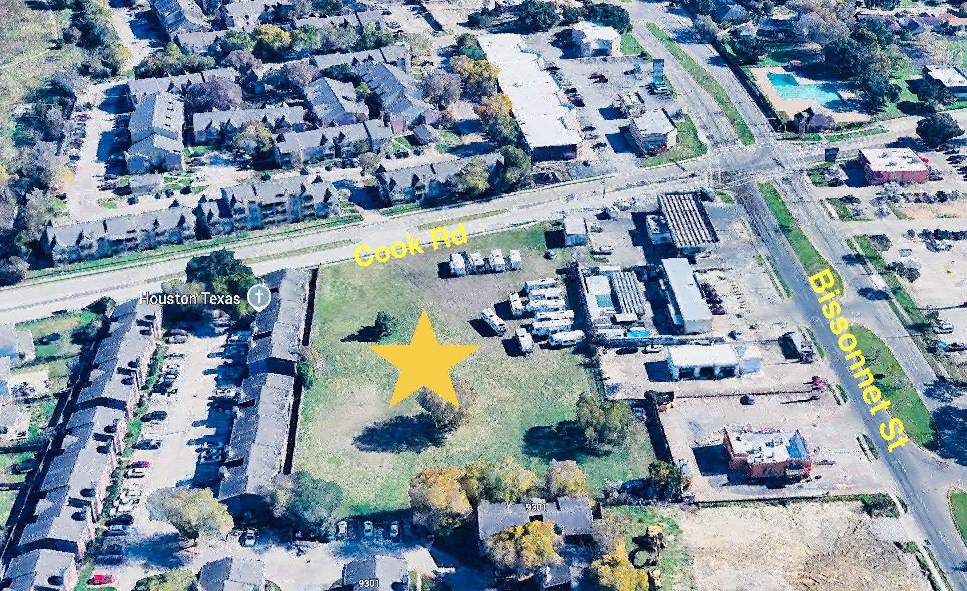 an aerial view of residential houses and outdoor space