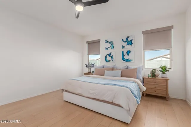 a bathroom with a bathtub a sink a mirror and a shower