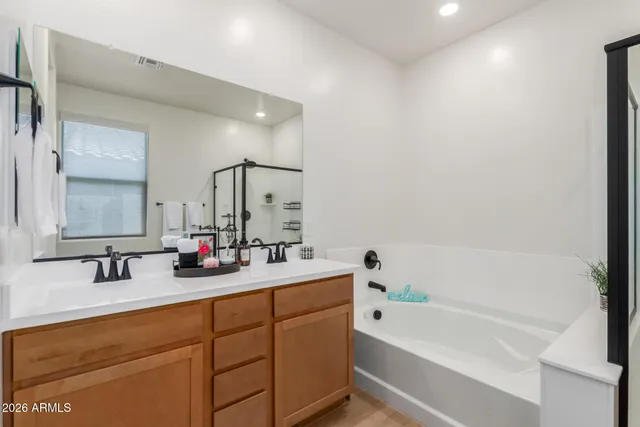 a bathroom with a bathtub and shower