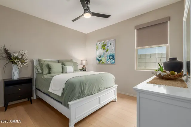 a bedroom with furniture and a window