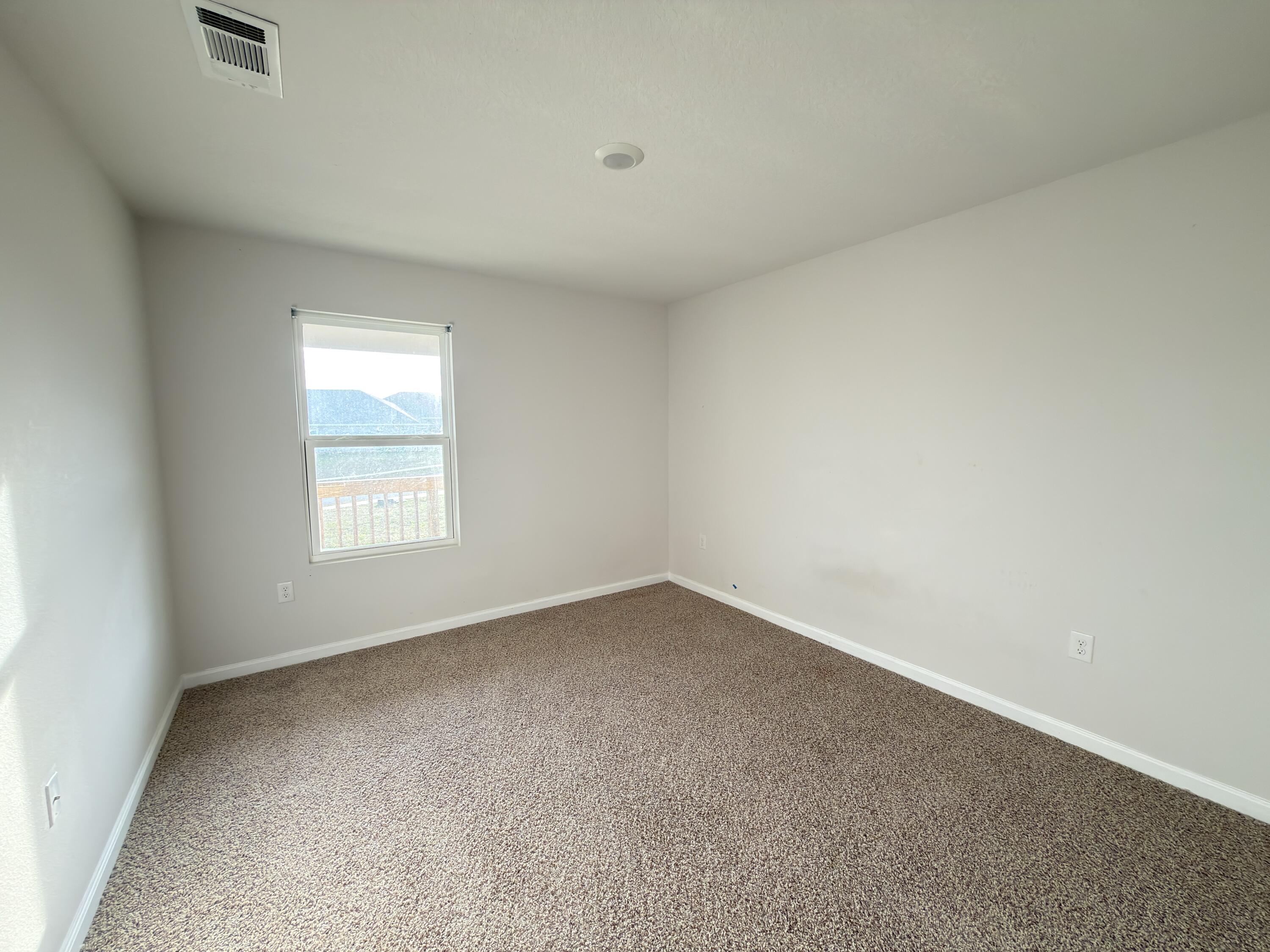 3545 Sugar Maple Lane Crestview, FL 32539 - Photo 18 of 27 an empty room with a window