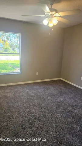 a view of an empty room with window