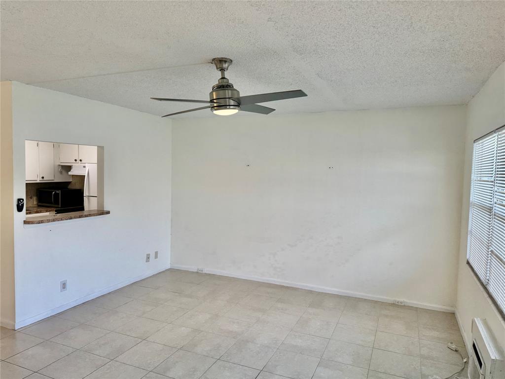 440 Fanshaw K, Unit 440 Boca Raton, FL 33434 - Photo 17 of 18 a view of a room with an empty space