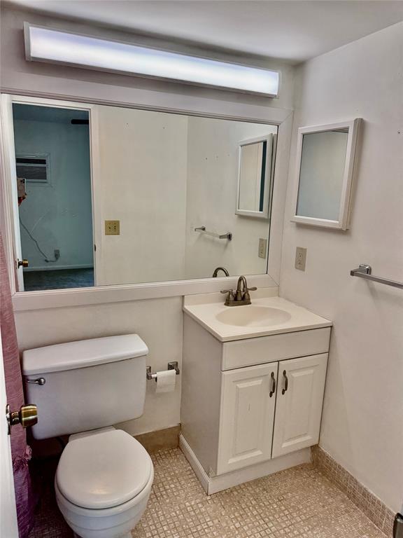 440 Fanshaw K, Unit 440 Boca Raton, FL 33434 - Photo 10 of 18 a bathroom with a sink a toilet and mirror
