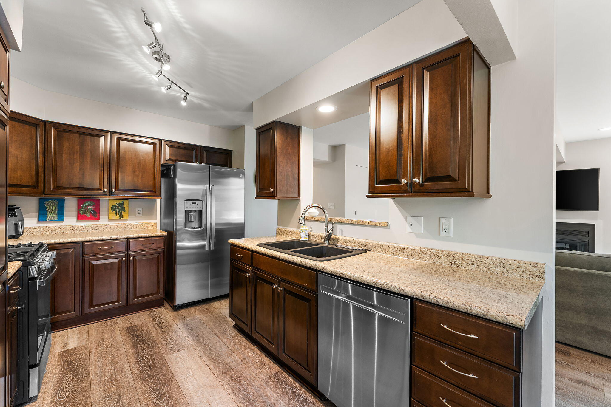 8748 Durbin Lane Crown Point, IN 46307 - Photo 15 of 47 a kitchen with stainless steel appliances granite countertop a sink stove and refrigerator