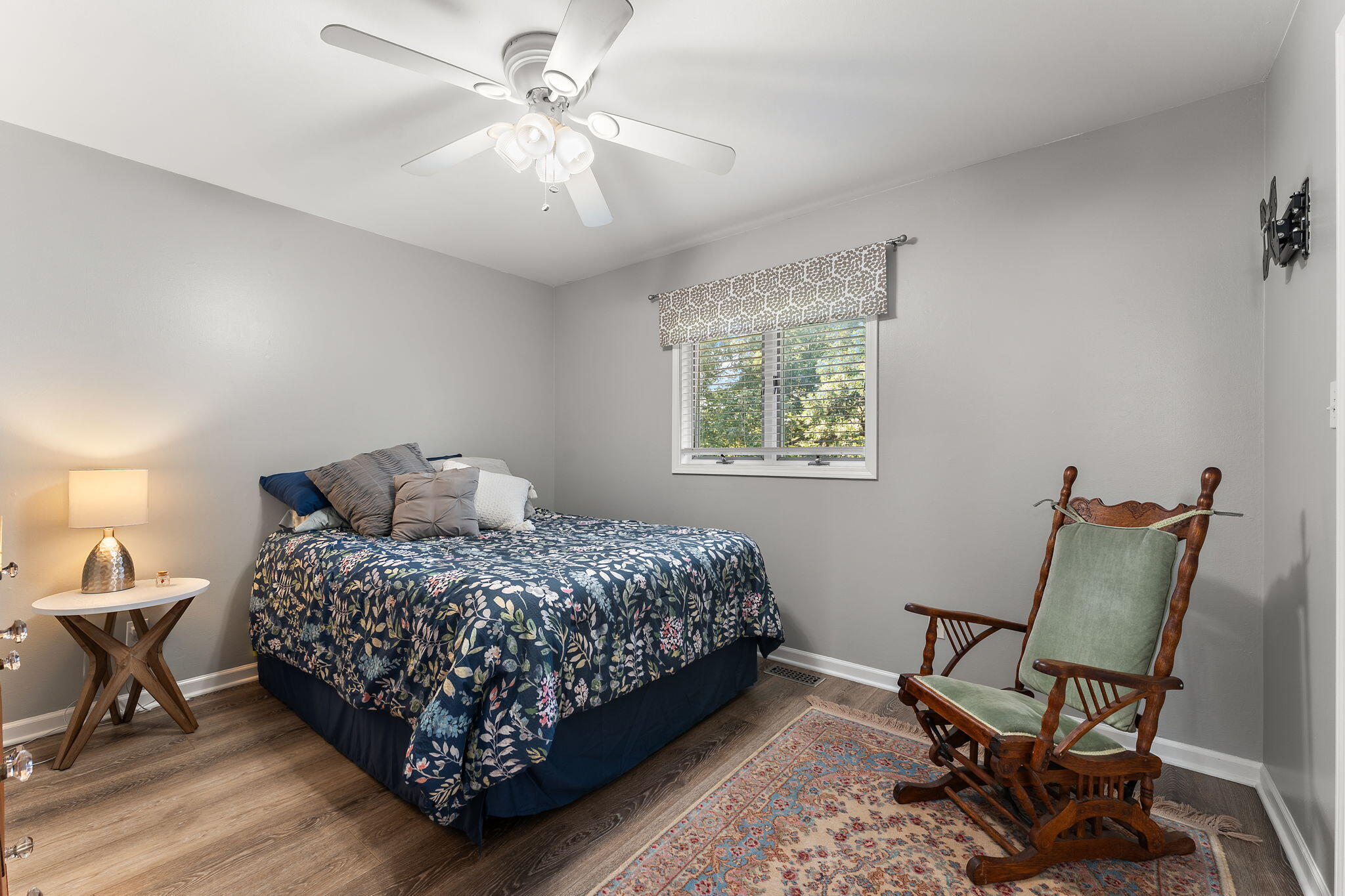 8748 Durbin Lane Crown Point, IN 46307 - Photo 28 of 47 a bedroom with a bed a chair and a chandelier