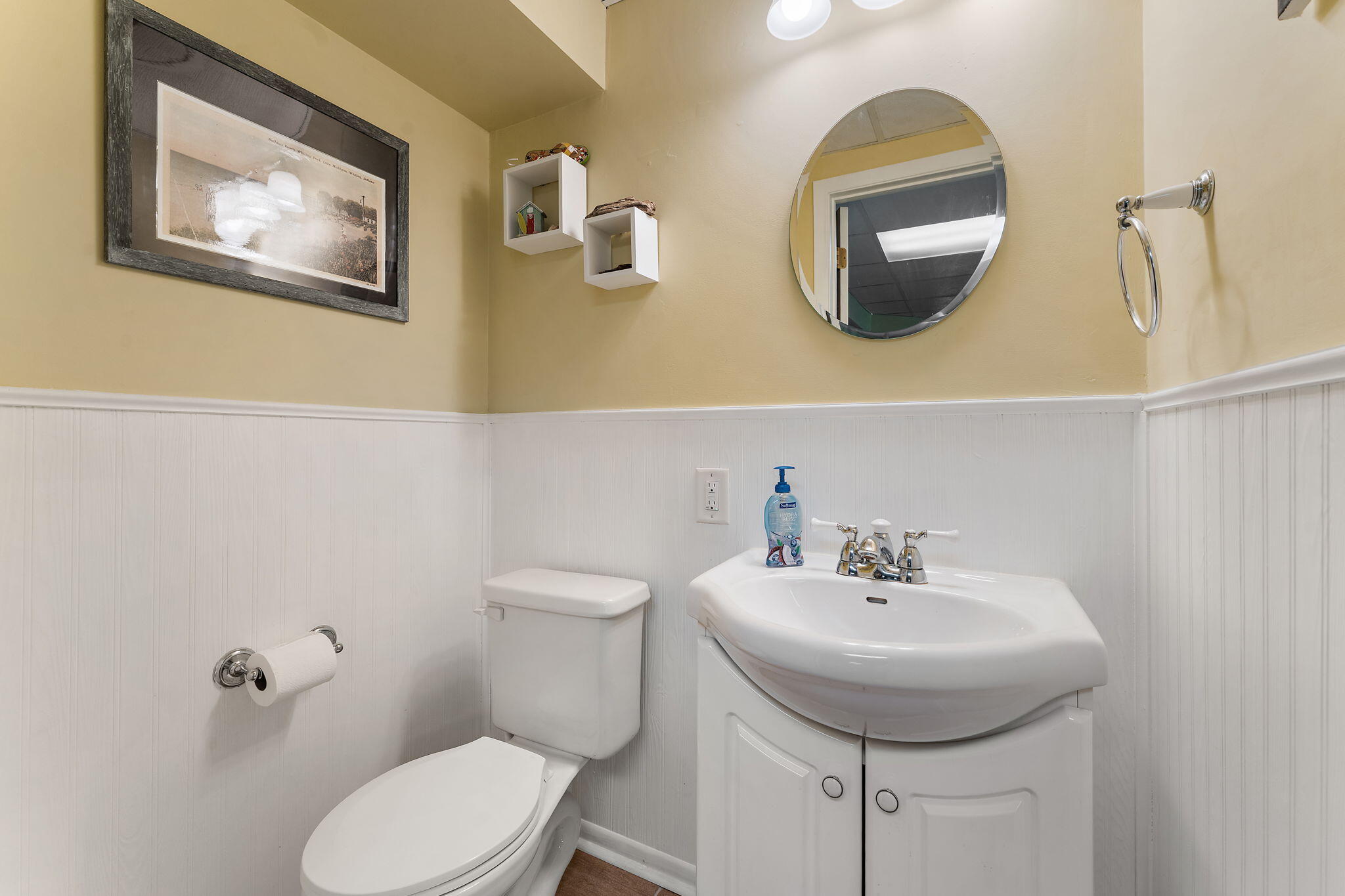 8748 Durbin Lane Crown Point, IN 46307 - Photo 32 of 47 a bathroom with a toilet a sink and mirror
