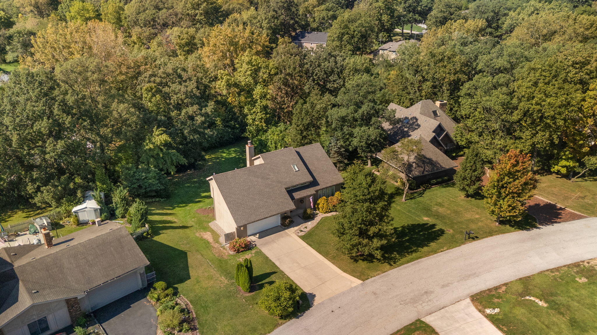 8748 Durbin Lane Crown Point, IN 46307 - Photo 47 of 47 an aerial view of a house with a yard and lake view