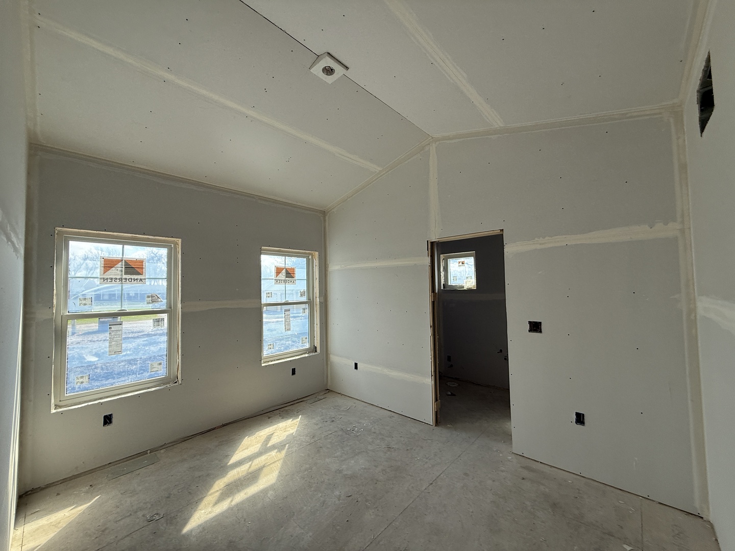 403 East Larmon Street Tolono, IL 61880 - Photo 5 of 22 a view of an empty room with window and stairs