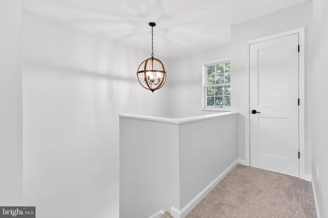 a view of a room with window and wooden floor