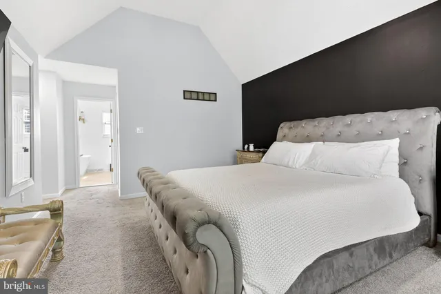 a white bath tub sitting next to a white sink