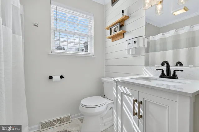 a view of a bathroom with a sink a toilet and a shower