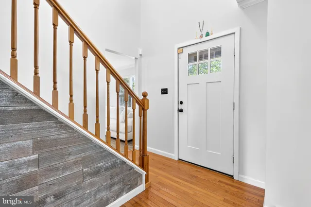 a view of an entryway with wooden floor