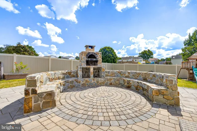 a building outdoor space with patio furniture and potted plants