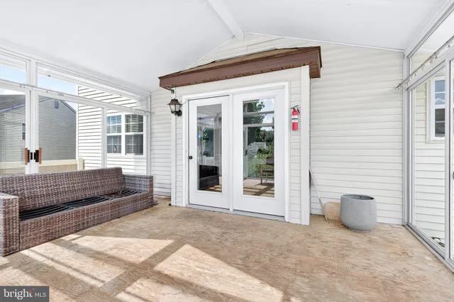 a view of a house with backyard porch and garden
