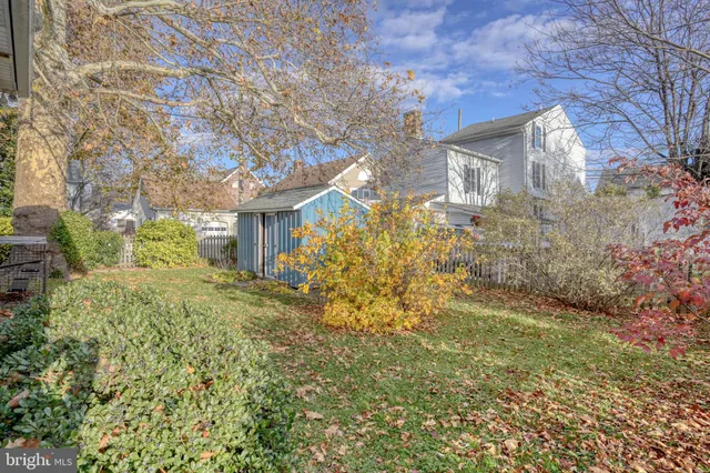 a backyard of a house with large trees