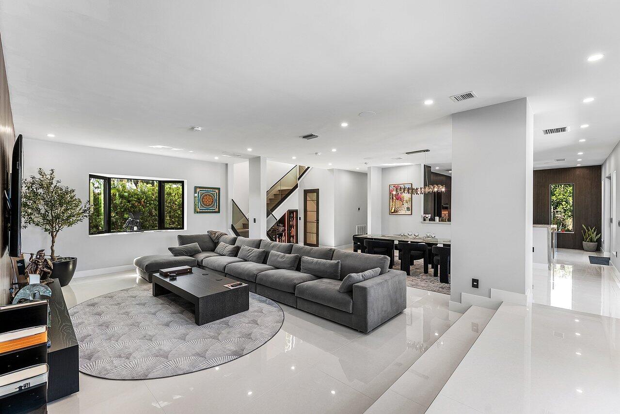 8387 Sawpine Road Delray Beach, FL 33446 - Photo 11 of 57 a living room with furniture and a large window