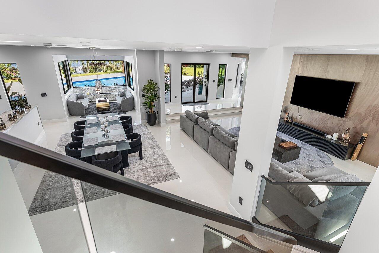 8387 Sawpine Road Delray Beach, FL 33446 - Photo 23 of 57 a living room with furniture and flat screen tv