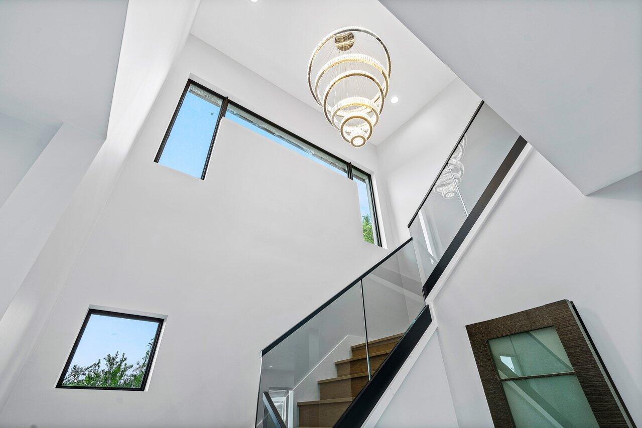 8387 Sawpine Road Delray Beach, FL 33446 - Photo 24 of 57 Grand Stairs & Chandelier-8387SawpineRoa