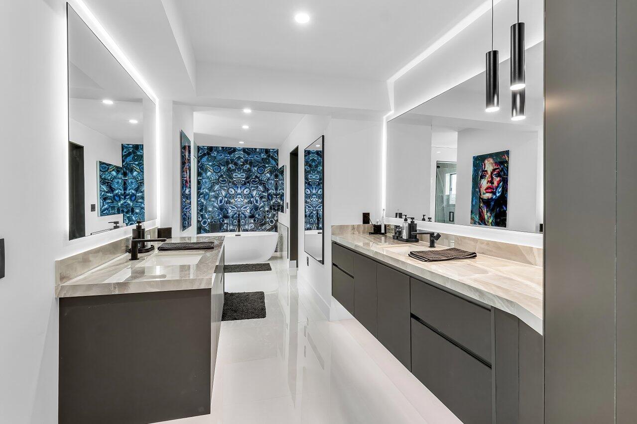 8387 Sawpine Road Delray Beach, FL 33446 - Photo 32 of 57 a large white kitchen with a large window