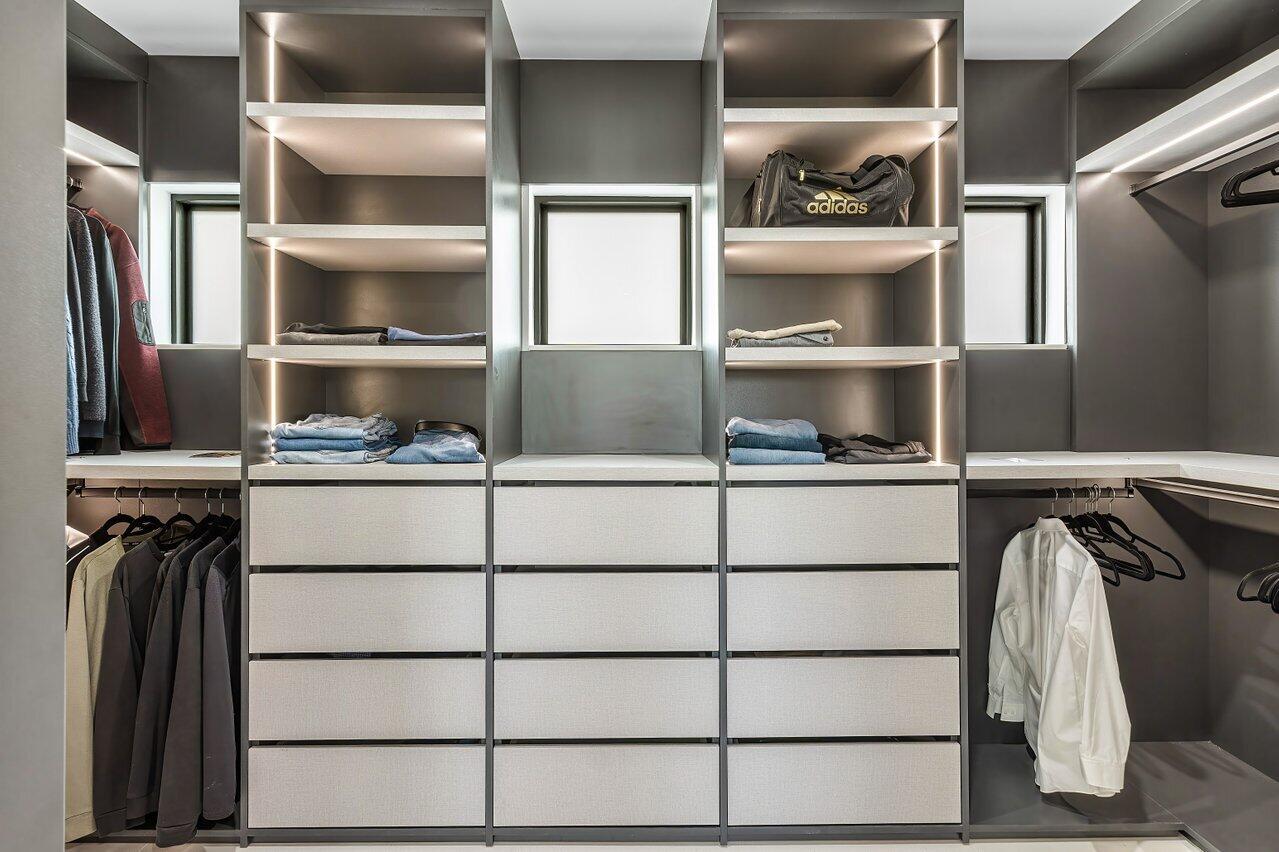 8387 Sawpine Road Delray Beach, FL 33446 - Photo 35 of 57 a view of walk in closet with empty racks